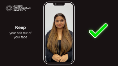 A photo of a student, on a cartoon phone where they have moved their hair behind their ears to kee the hair out of thier face and a green tick on the right of the screen