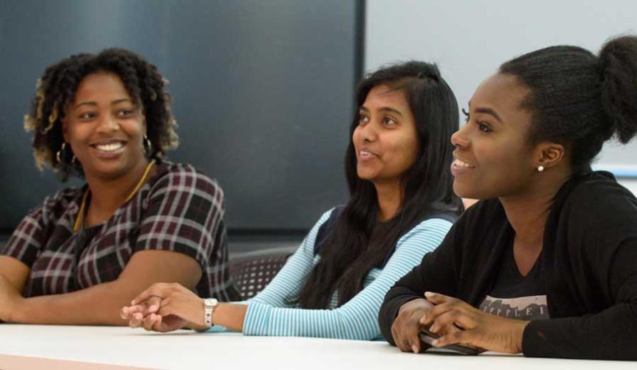 Students chatting and studying in the Graduate Centre