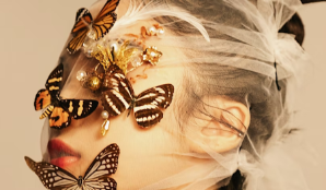A woman with butterflies on her face