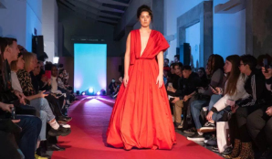 A model walking down the catwalk in an AAD student fashion show