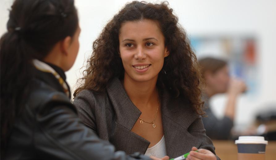 Two students in mid-conversation.