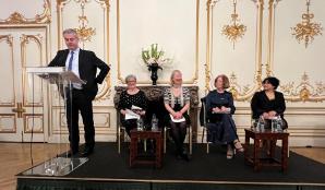 Louise, Neha on stage with the Irish Ambassador to the UK