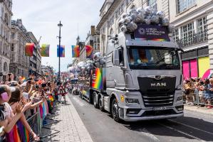 London Met float at Pride in London surrounded by marchers and spectators